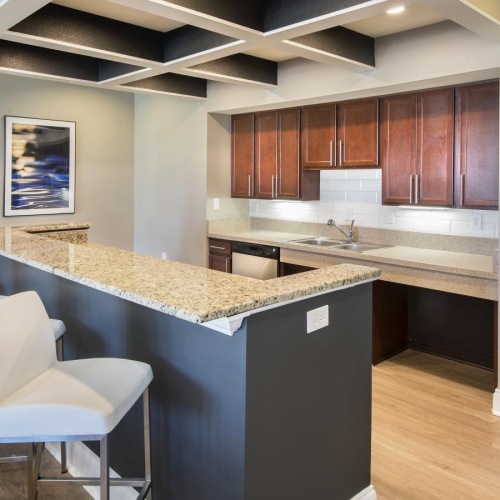 Find your perfect fit at The Promenade at Beavercreek a kitchen with a bar and island